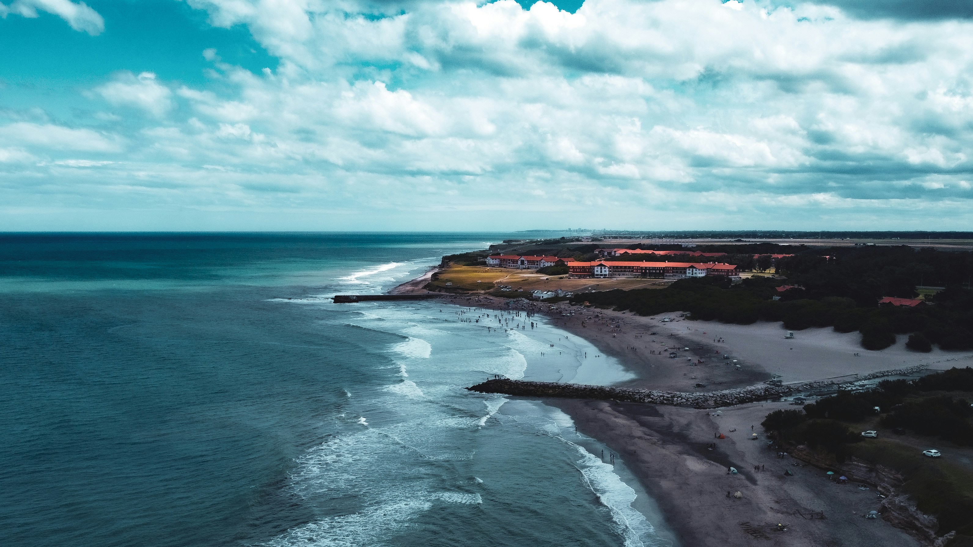 an aerial view of a beach and a body of water