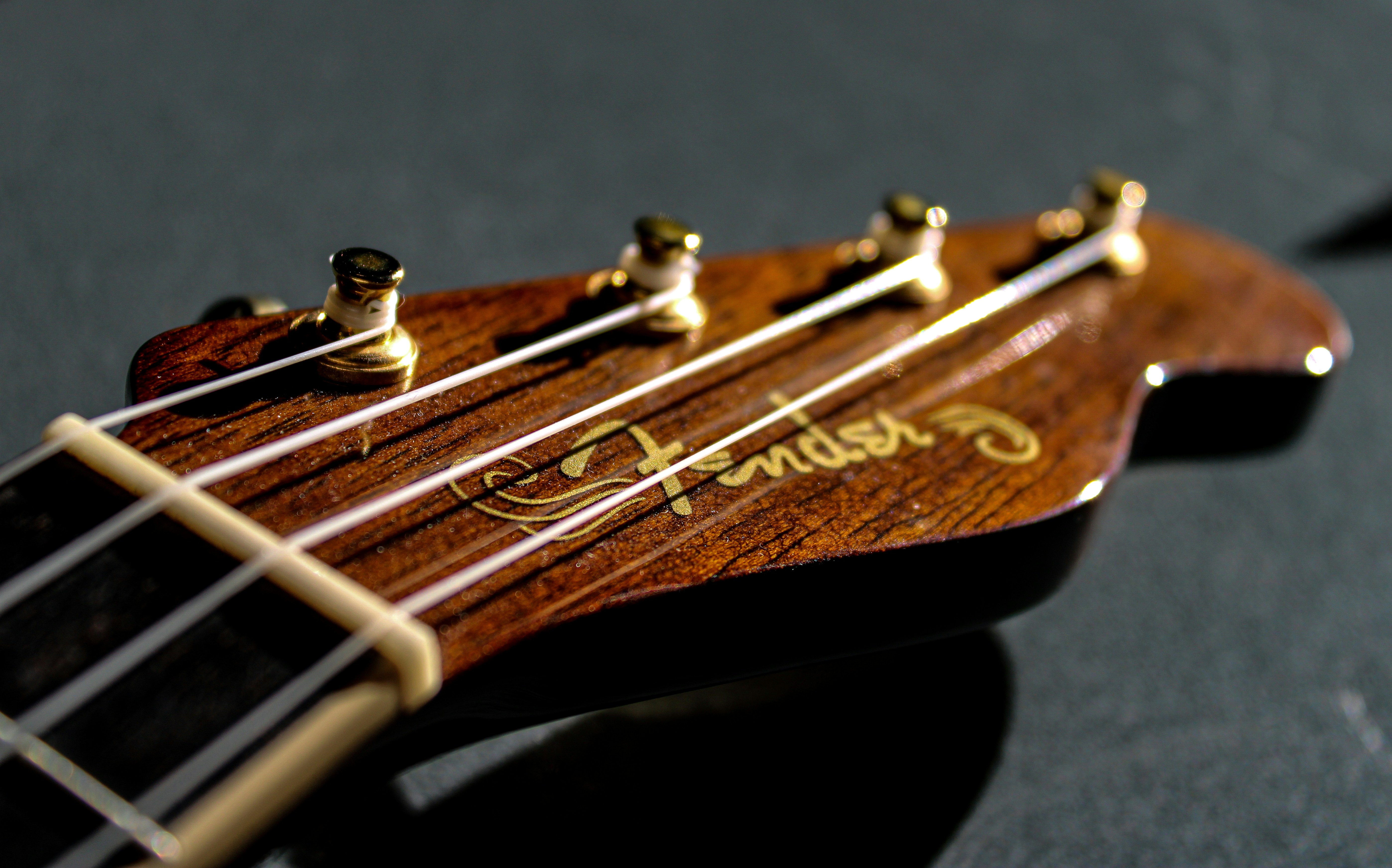 a close up of a guitar's neck and frets