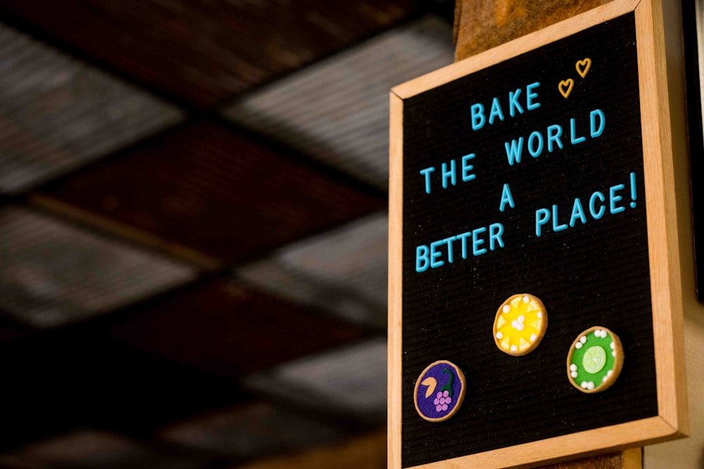 a sign that says bake the world a better place