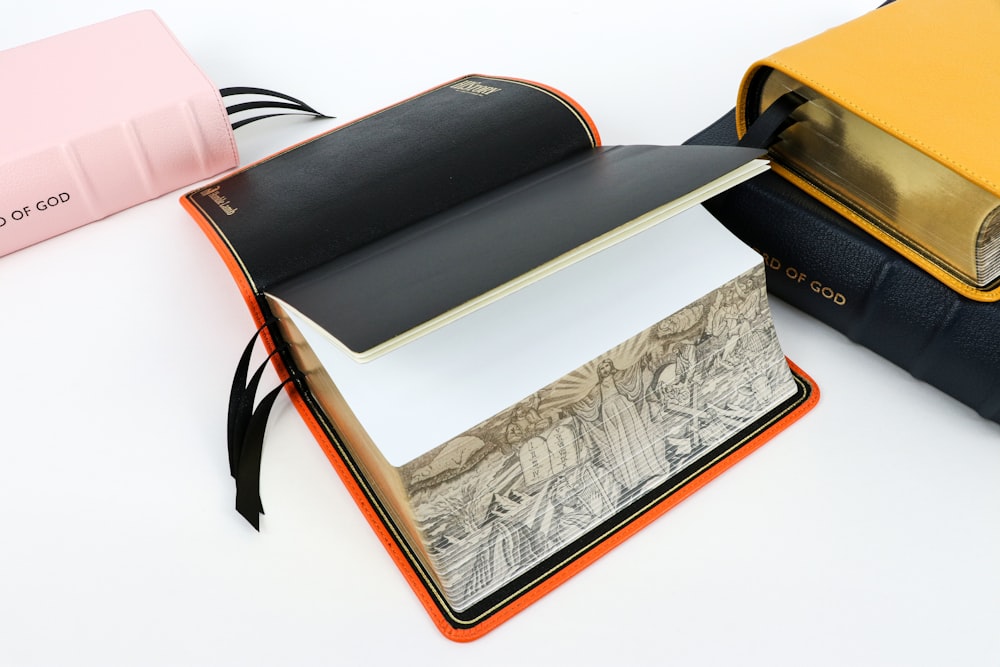 a stack of books sitting on top of a white table