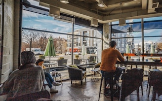 a group of people sitting at a table in a restaurant