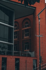 Renovated historic building with modern glass additions and restored brickwork.