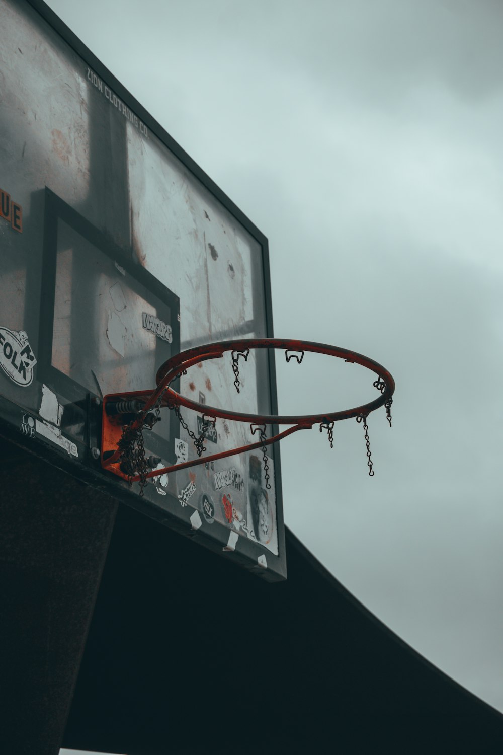 a basketball going through the rim of a basketball hoop
