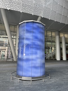 Wide shot of a modern engineering facility featuring navy blue structural elements and electric blue accents.