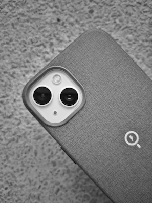 Close-up of a budget-friendly phone showing its textured back and camera setup.