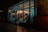 A street-level view of a brightly lit clothing store as seen through large glass windows at night. The store is well-lit with several garments hanging on racks and shelves visible inside. There are stairs leading up into the shop and a reflection of the outside street can be seen in the glass.