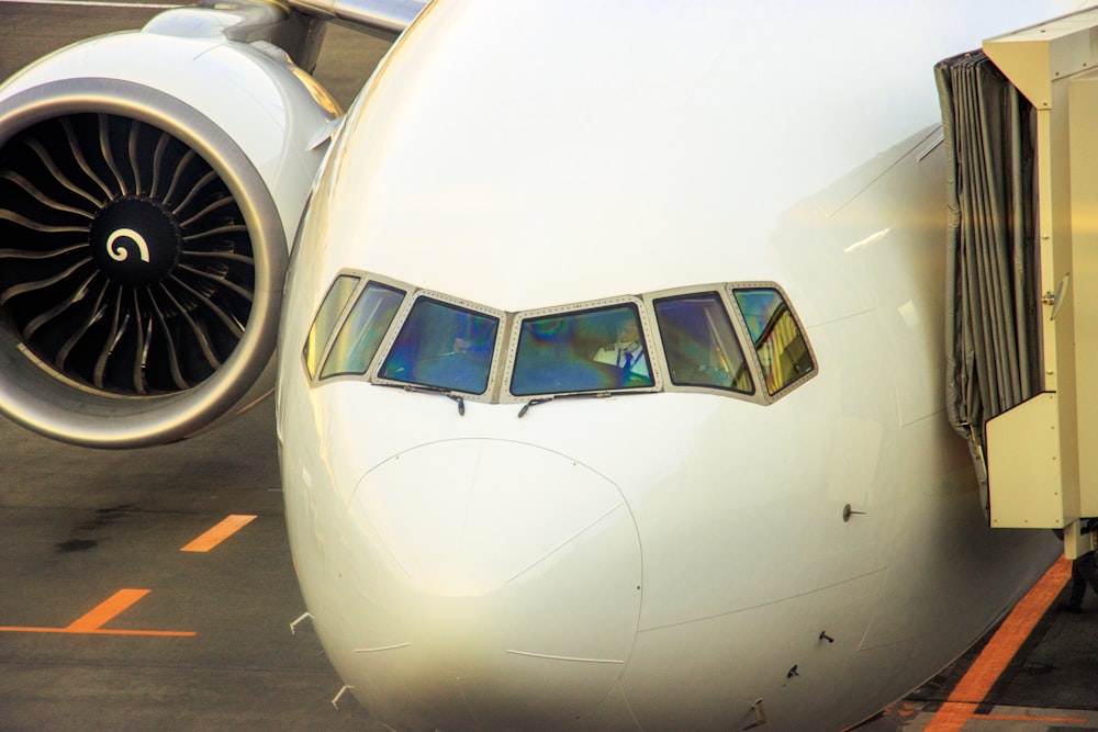 a large jetliner sitting on top of an airport tarmac