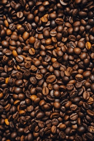 a pile of coffee beans and coffee beans