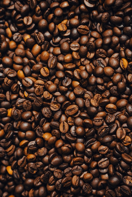 a pile of coffee beans and coffee beans