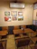 A warm, inviting consultation room filled with traditional Kerala decor and astrology tools.