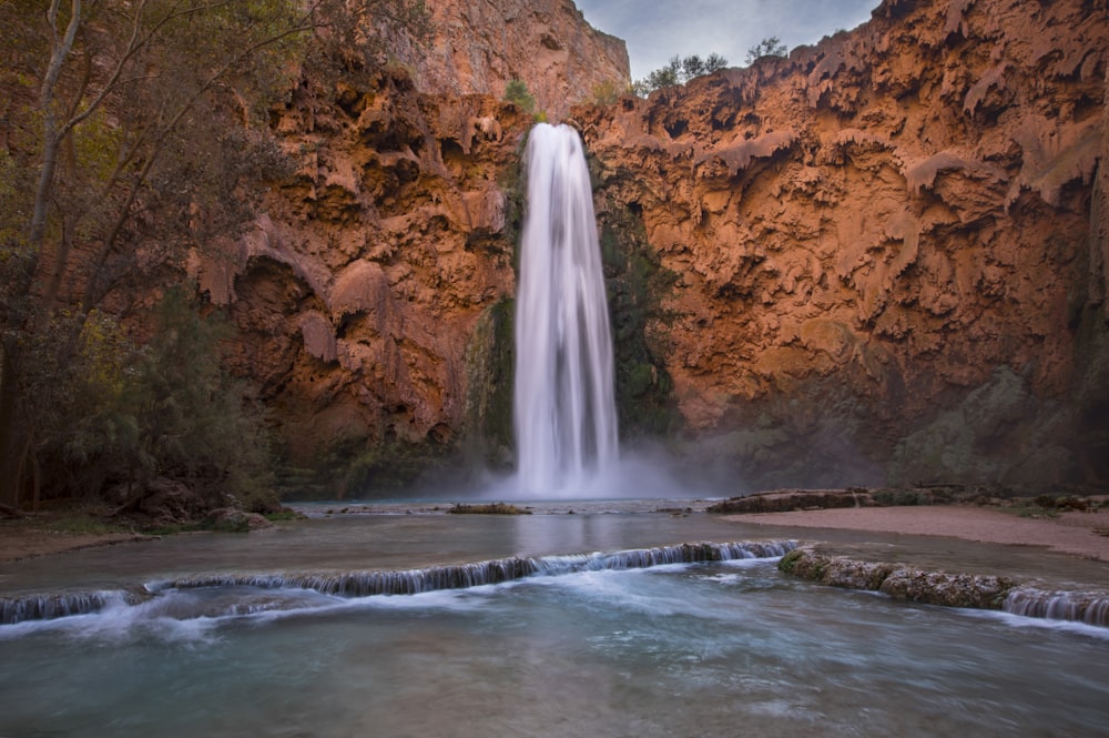 a large waterfall with a waterfall in the middle of it