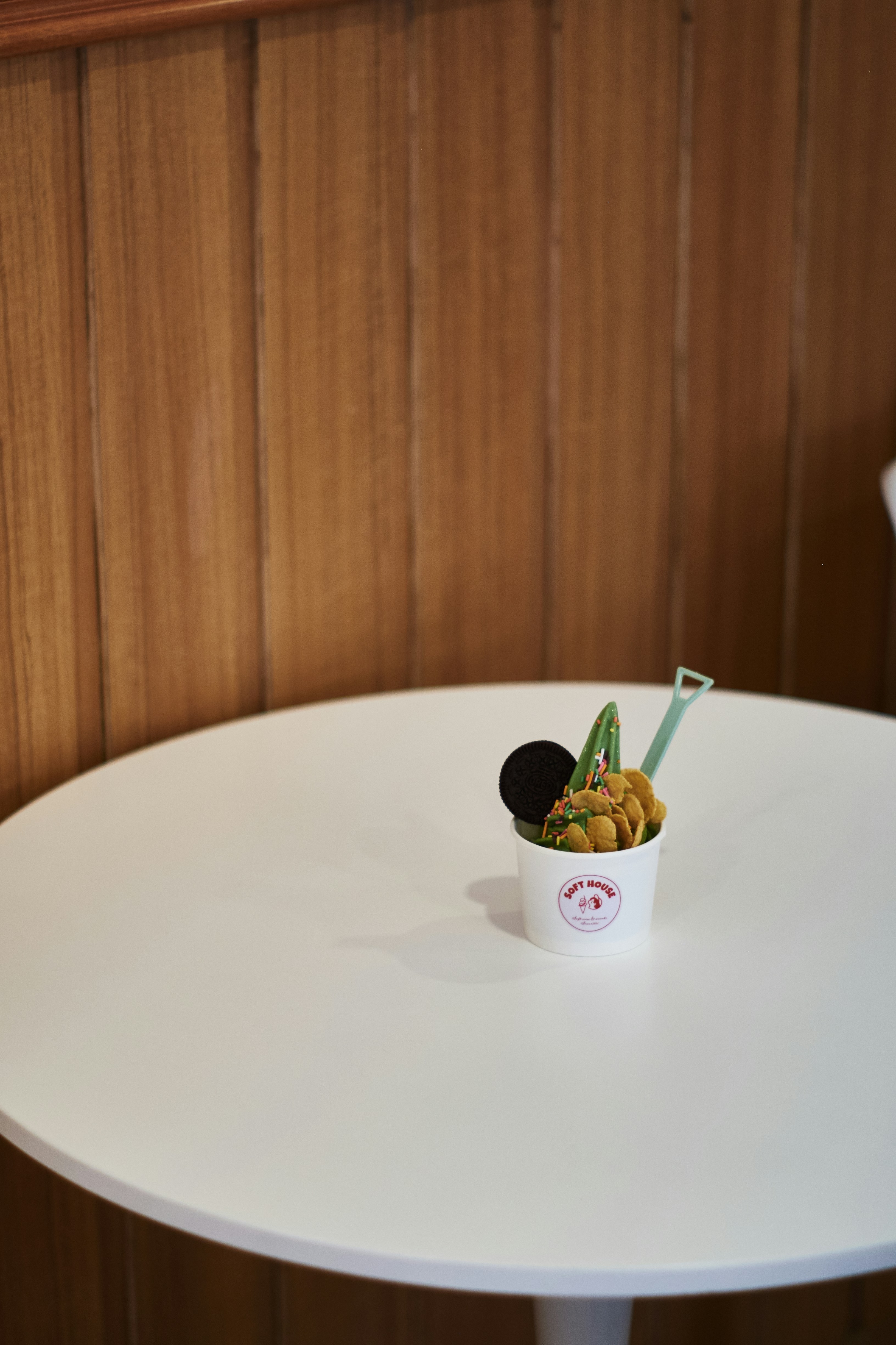 Kids froyo cup with rainbow sprinkles and chocolate chips, cheerful and colourful