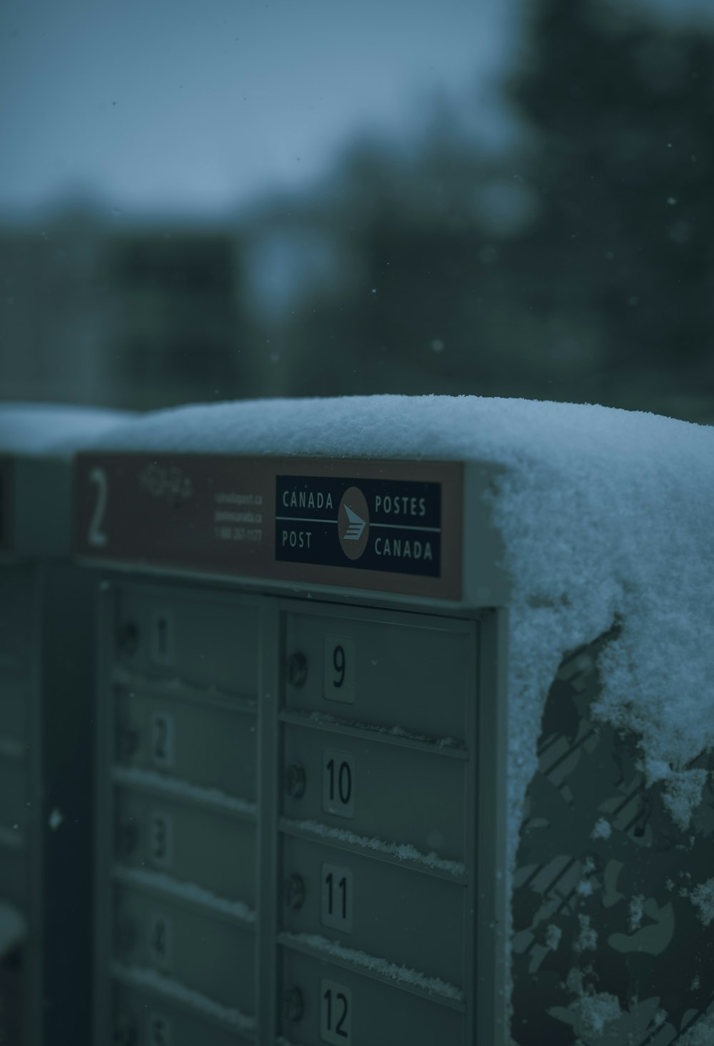 a mailbox covered in snow on a snowy day