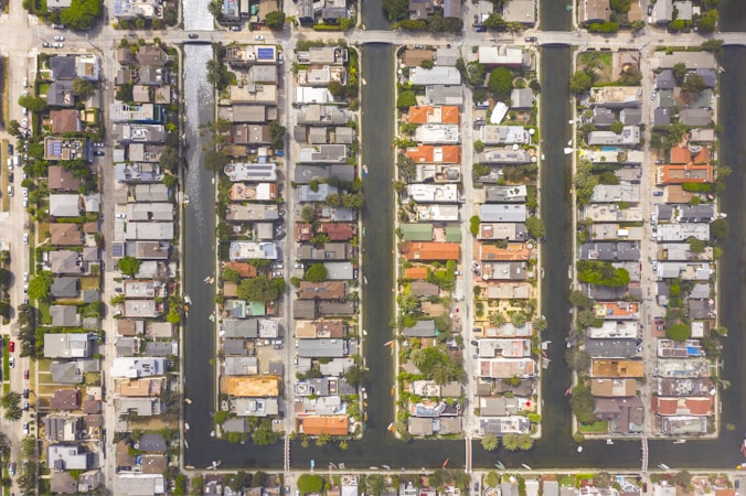 Aerial view of a suburban neighborhood packed with single-family homes, showing limited developable land