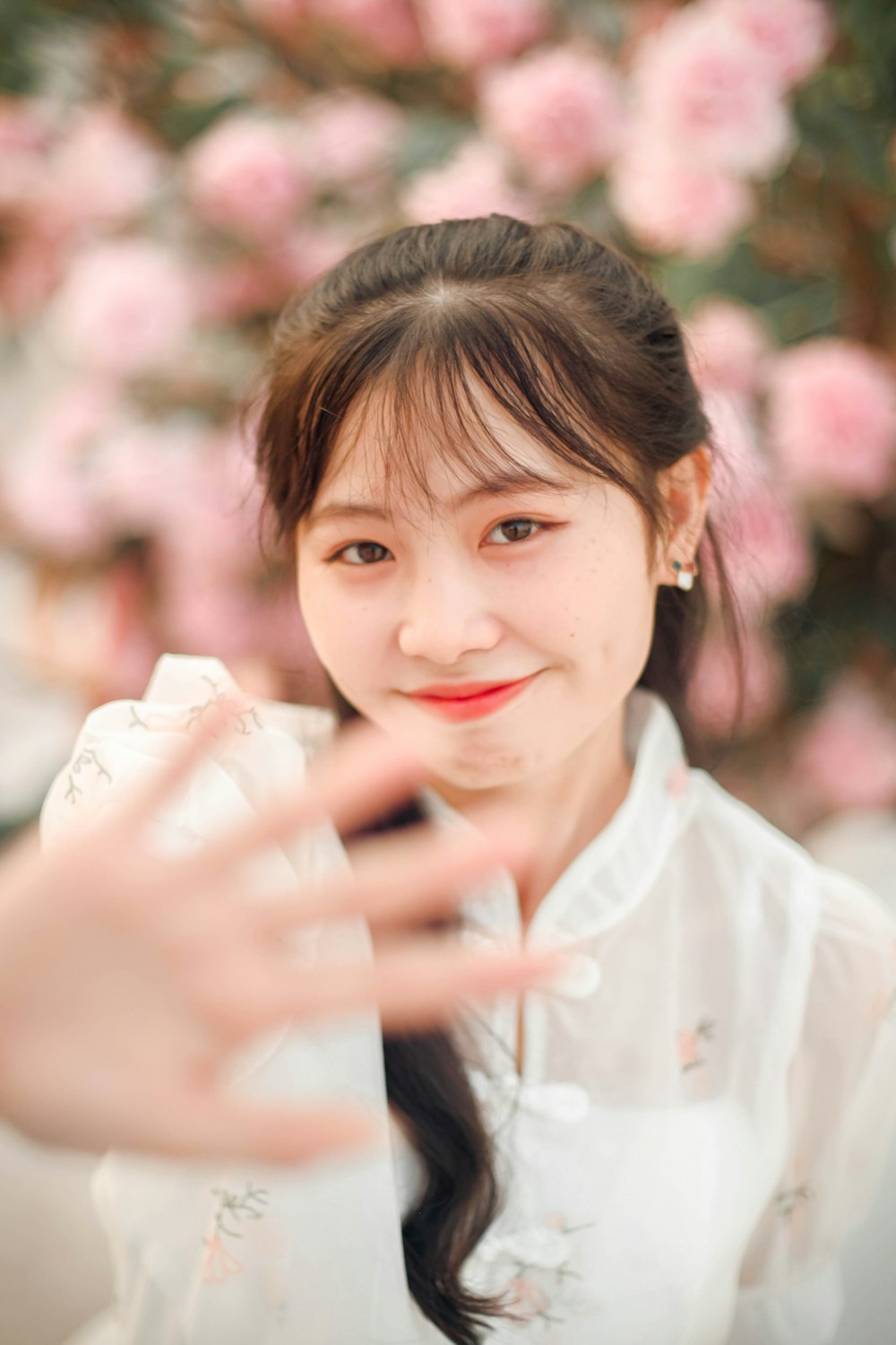 a woman in a white shirt posing for a picture