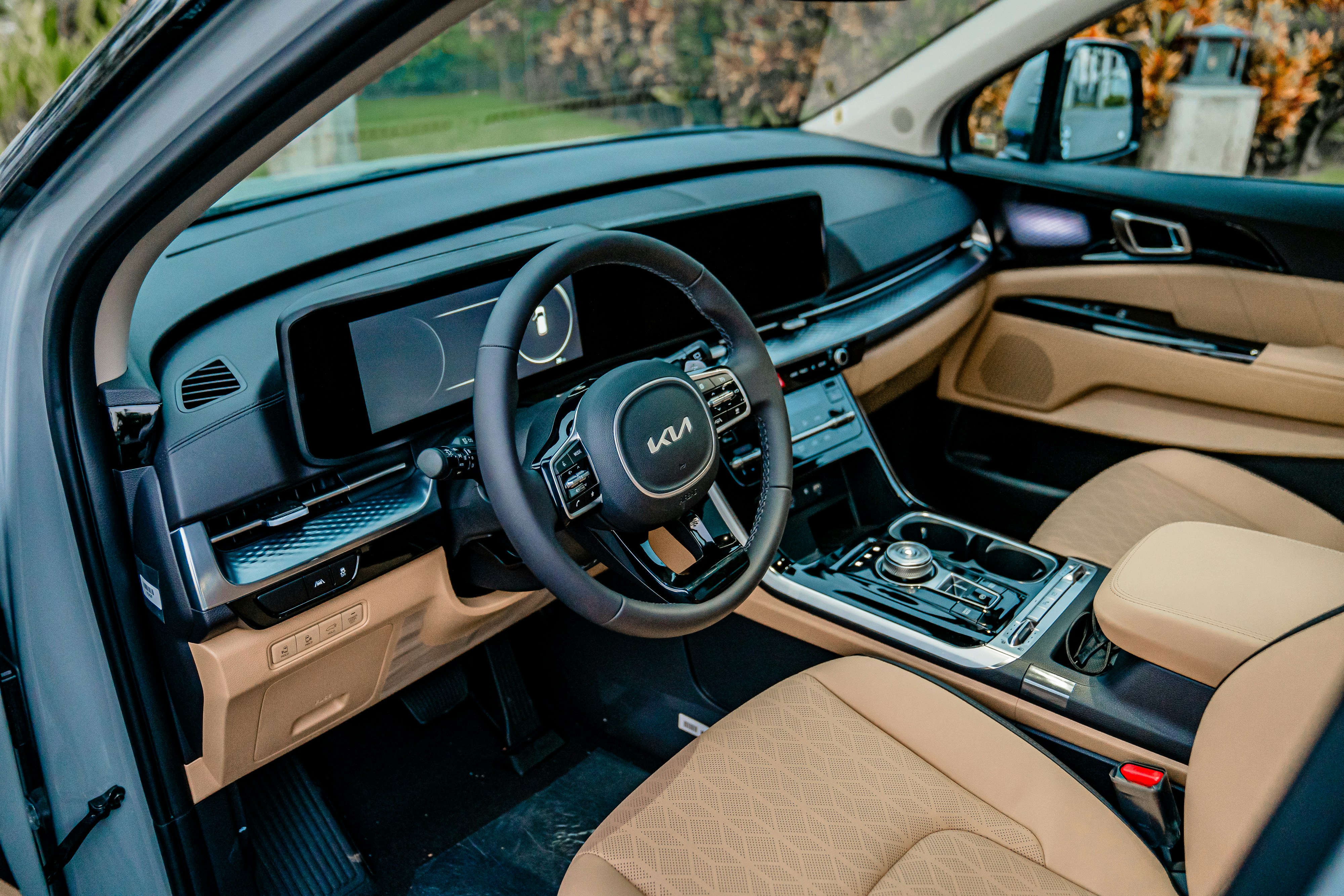 Luxury SUV interior with leather seats and wide touchscreen display