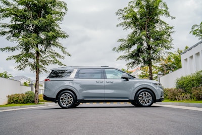 Side profile of a spacious family van with tinted windows.