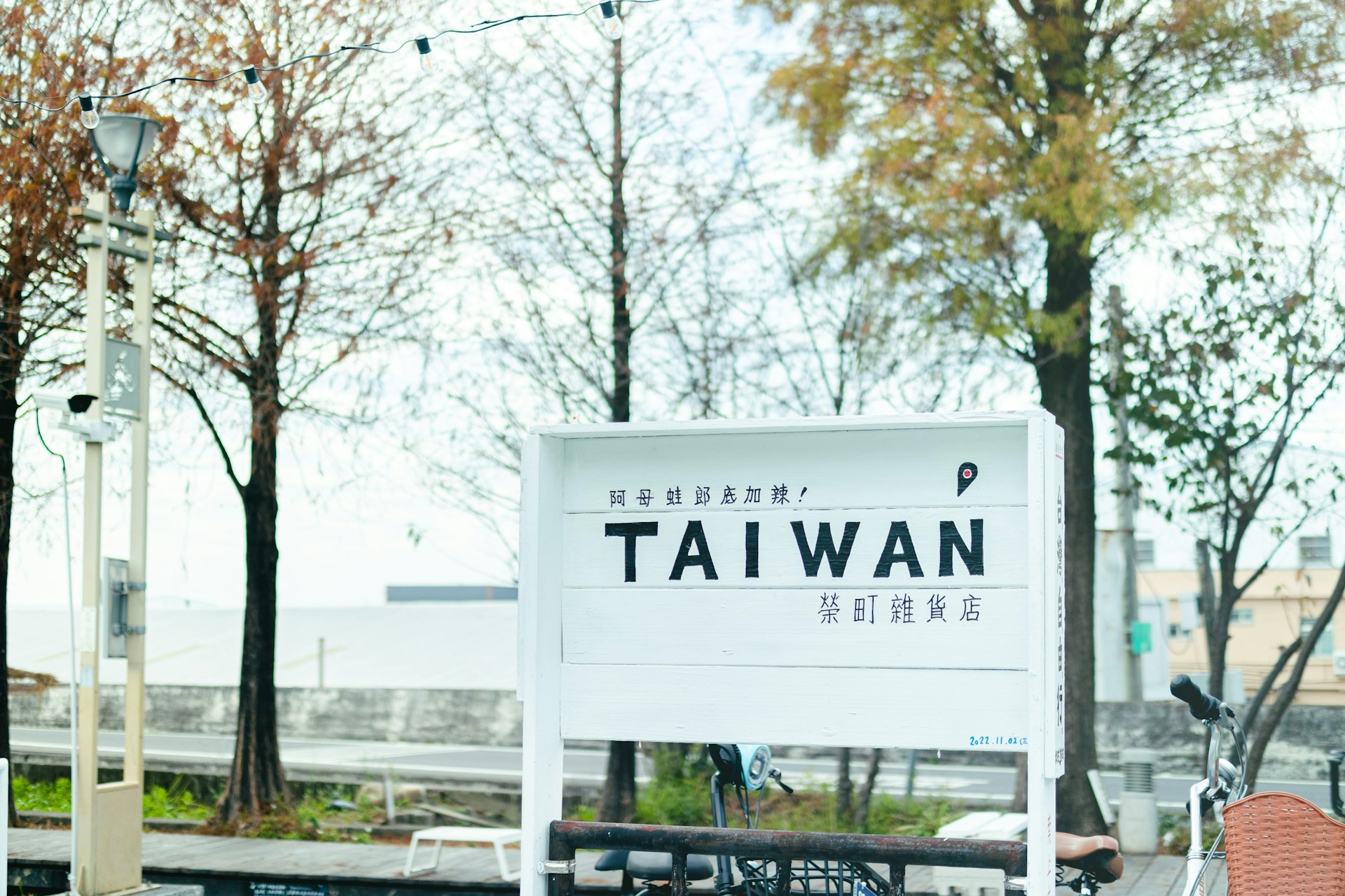 woman wearing yellow long-sleeved dress under white clouds and blue sky during daytime