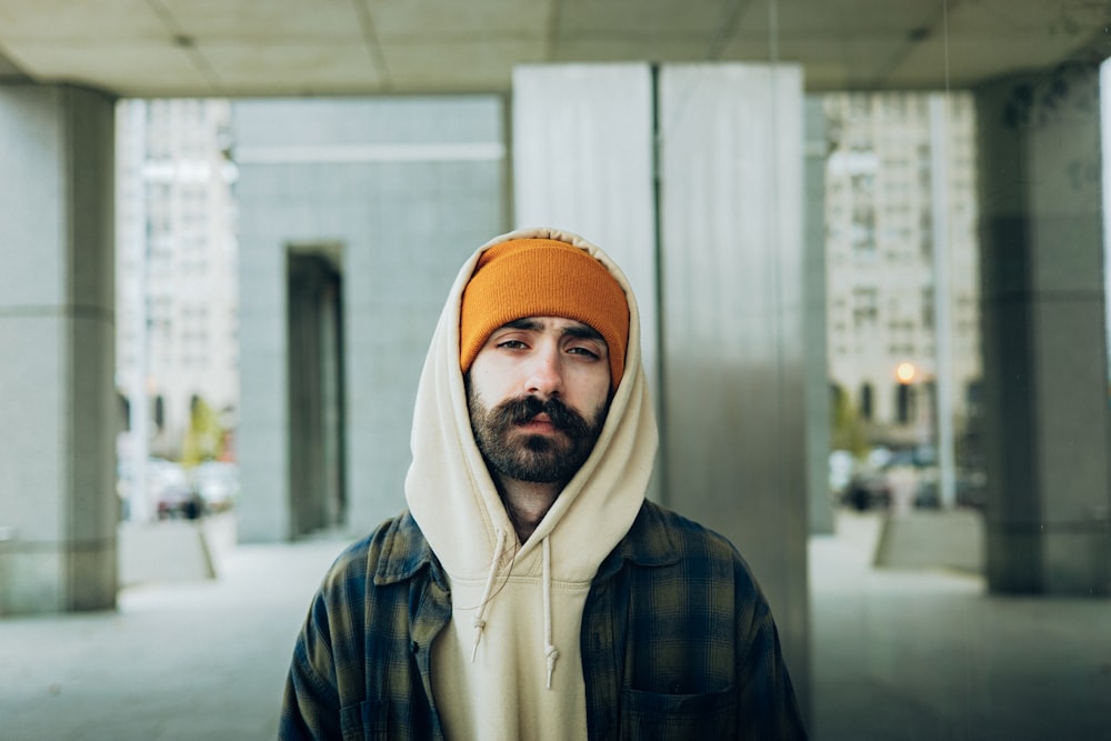 a man with a beard wearing a hoodie