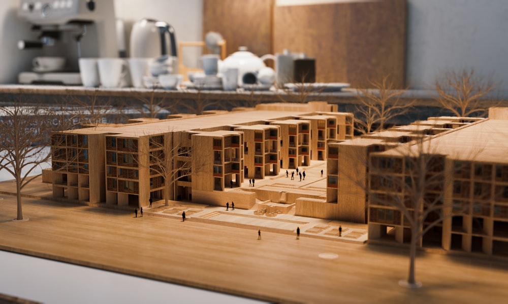 a model of a wooden building with trees in front of it