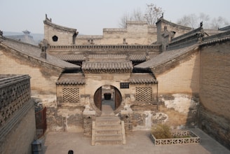 a stone building with a staircase leading up to it