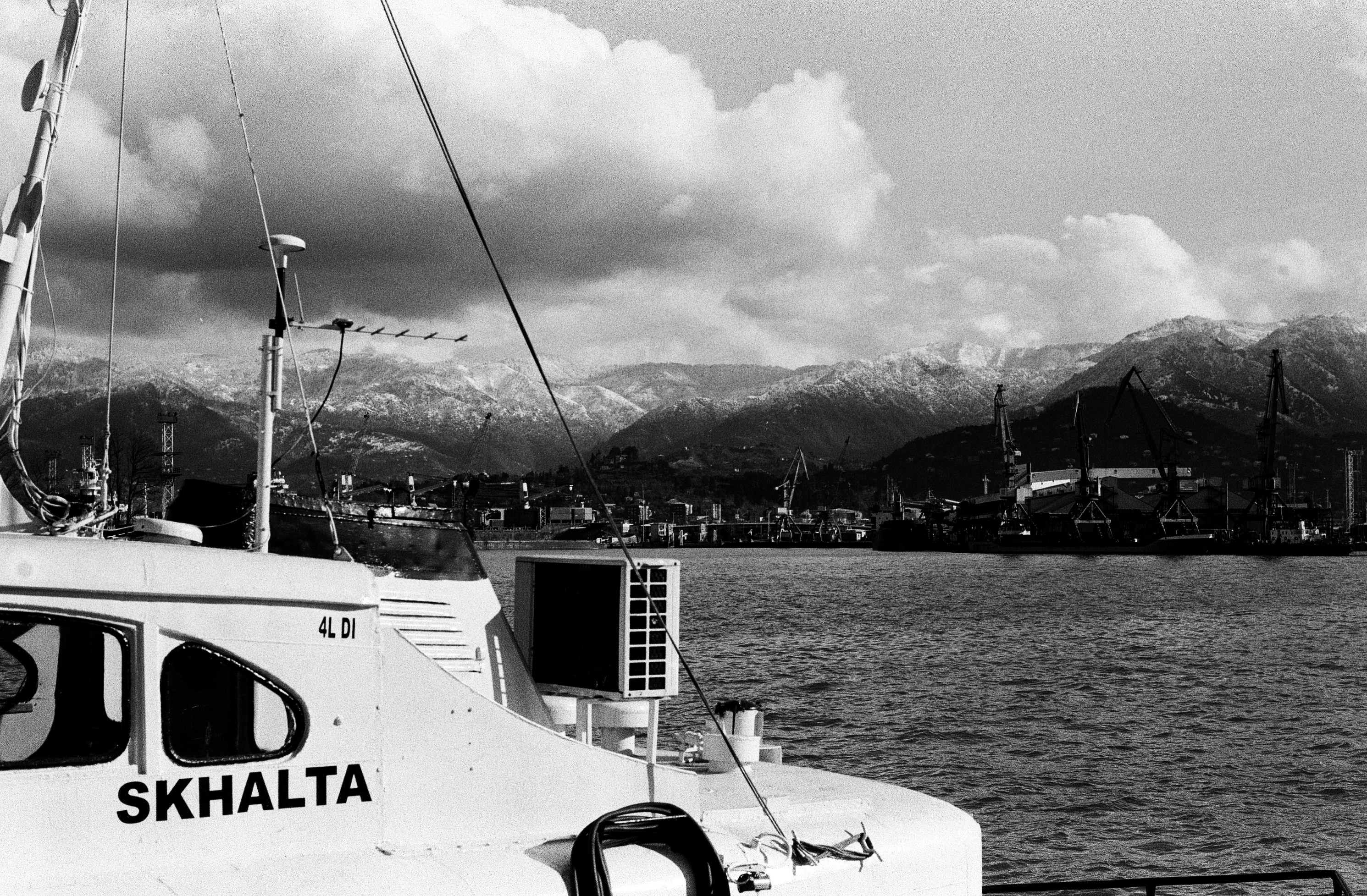 a black and white photo of a boat in the water