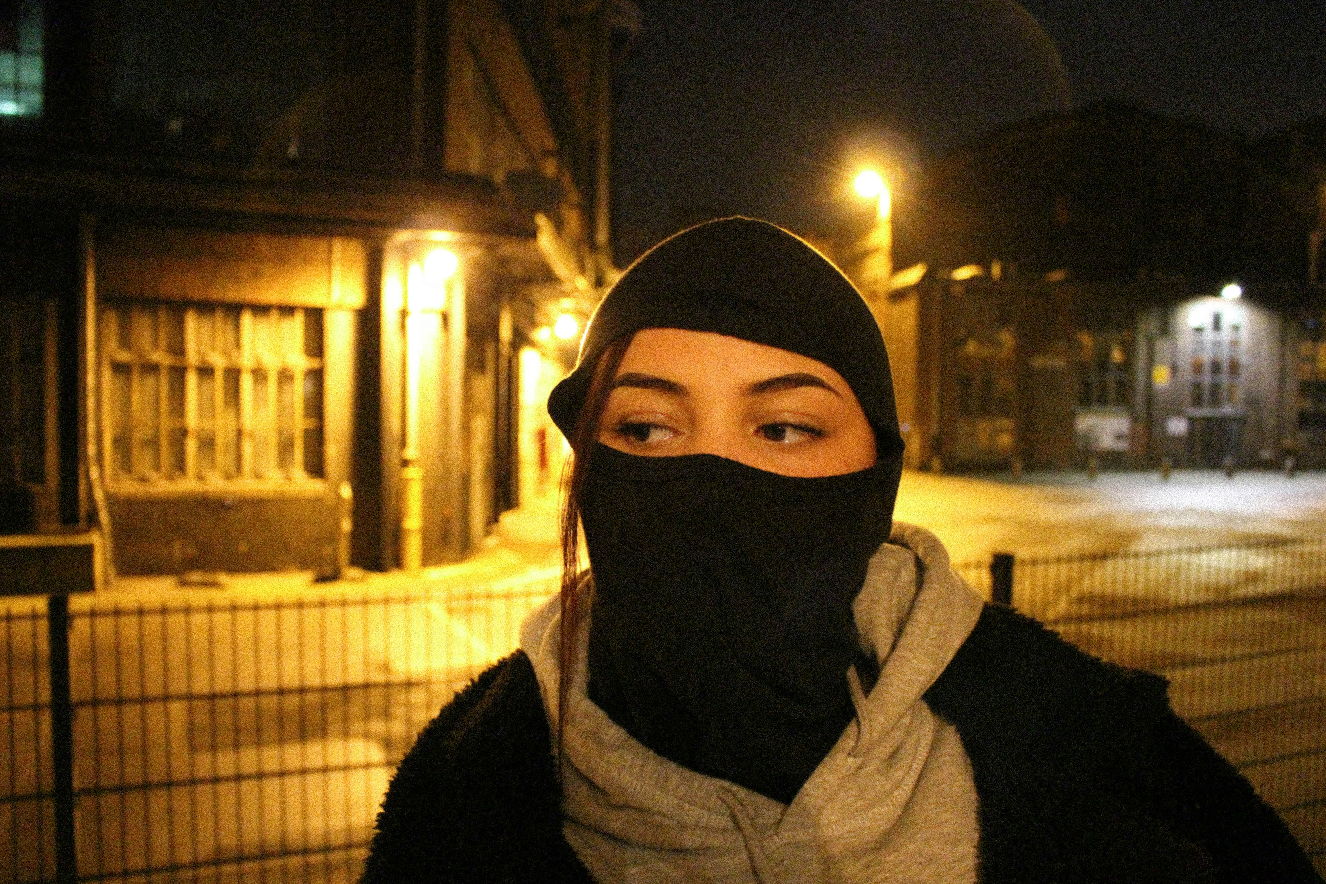 A woman wearing a black mask and a scarf photo – Free Criminal Image on ...