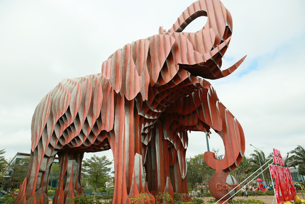 a sculpture of an elephant made out of strips of paper