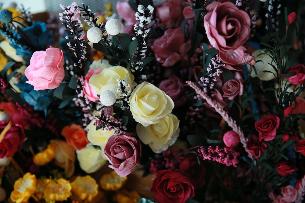 a bunch of flowers that are sitting on a table