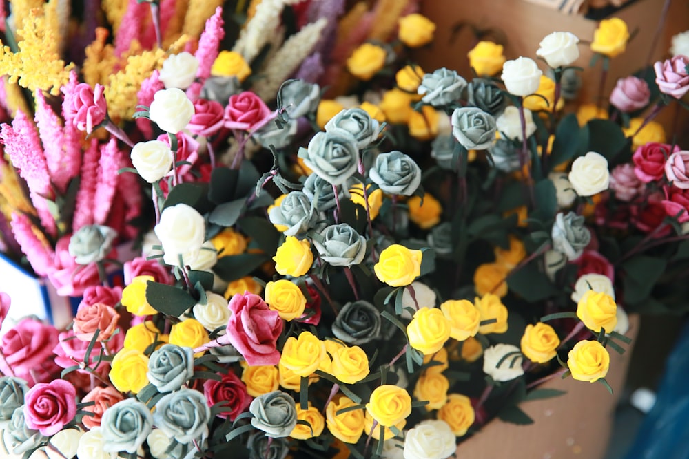 a bunch of fake flowers sitting on top of a table