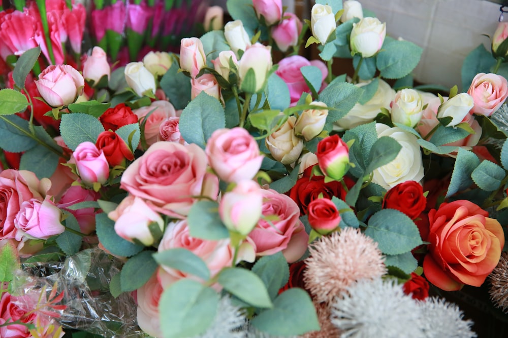 a bunch of flowers that are sitting on a table