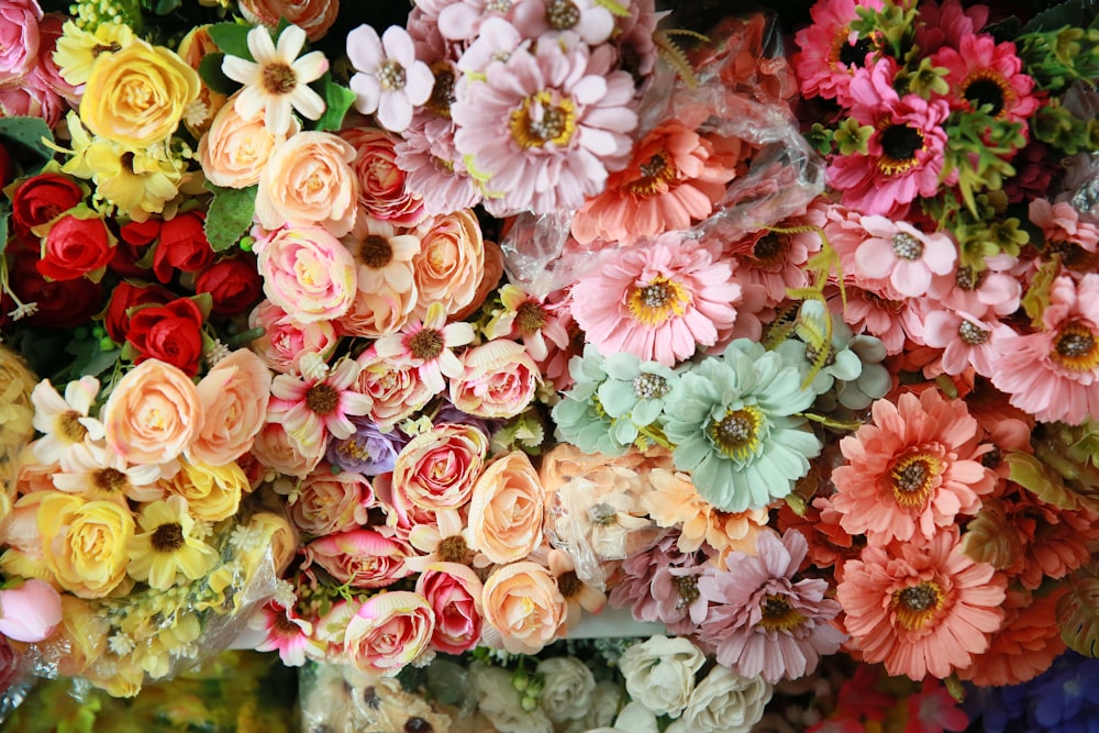 a bunch of flowers that are sitting on a table