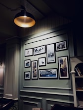 Cozy photo studio interior with warm lighting and family portraits on the walls.