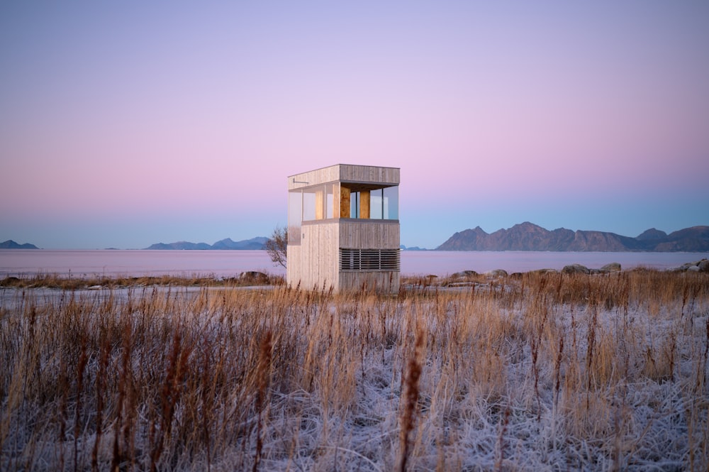 a tall tower sitting in the middle of a field