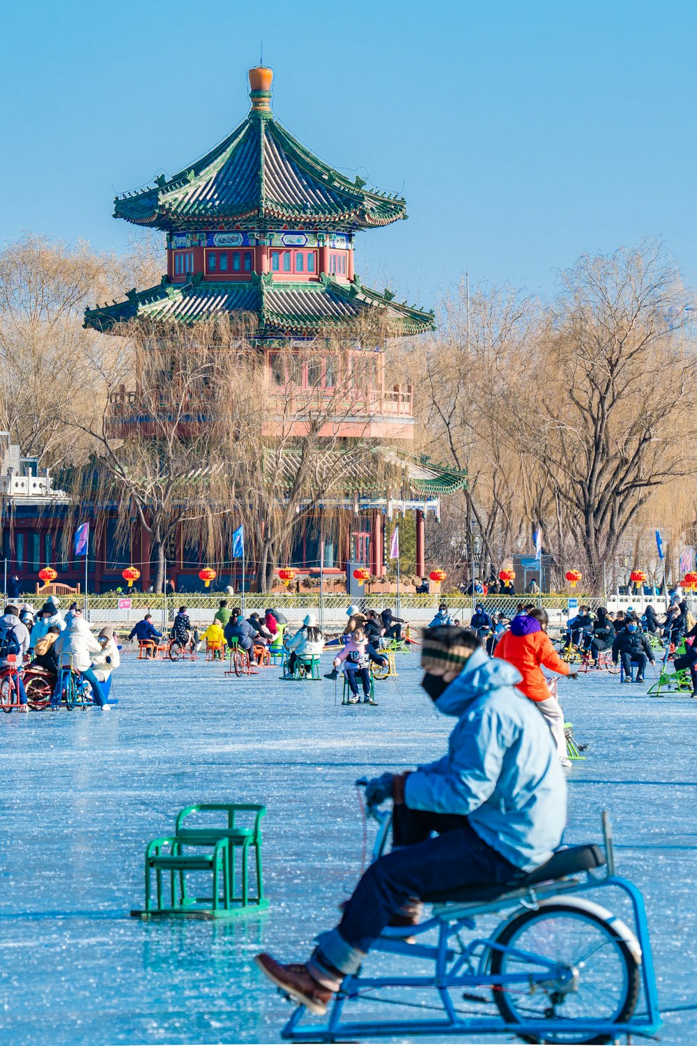 a man riding a bike across a frozen lake