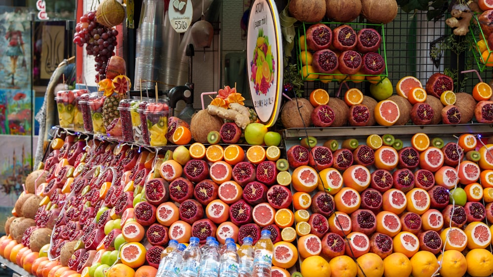 a fruit stand with a variety of fruits on display