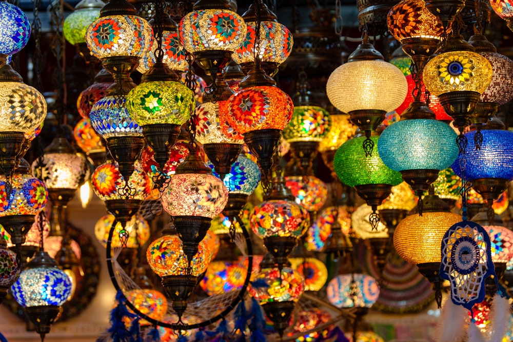 a bunch of colorful lights hanging from a ceiling