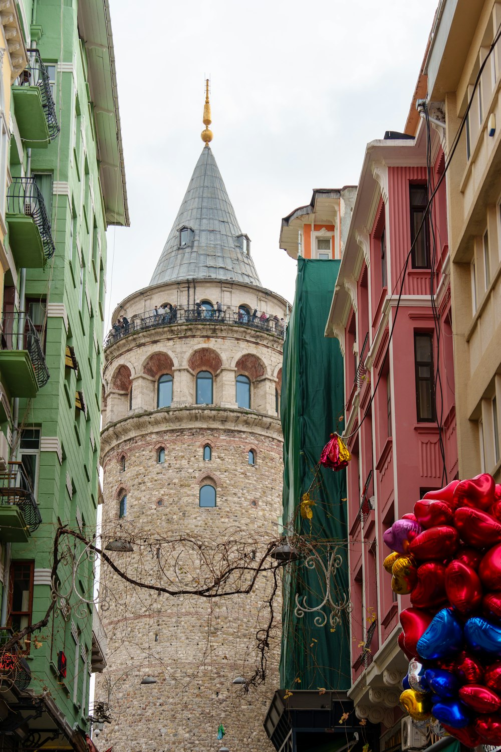 a tall tower with a clock on the top of it