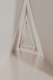 a white room with a triangle shaped wall