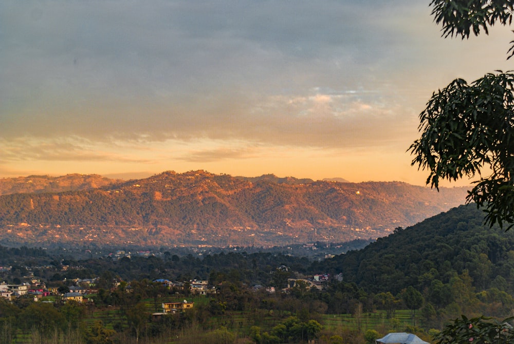 a view of a mountain range at sunset