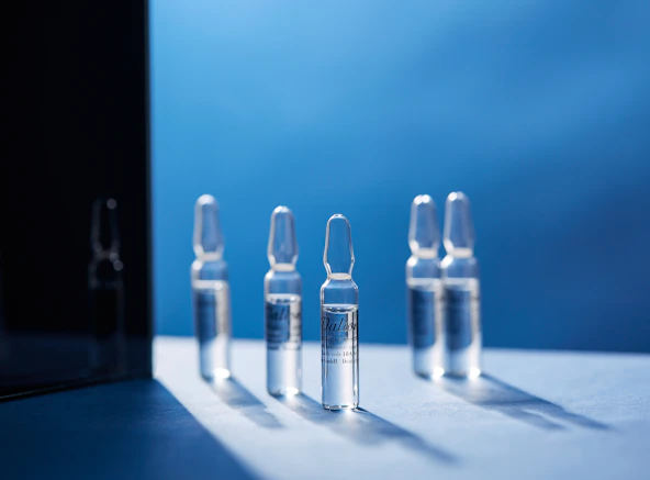 a group of glass bottles sitting on top of a table