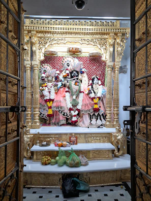 A serene altar adorned with golden offerings and candles dedicated to Mãe Oxum.