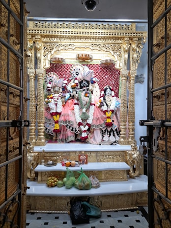 Close-up of sacred offerings arranged neatly on a gold-trimmed altar during a shakti upasana ceremony.
