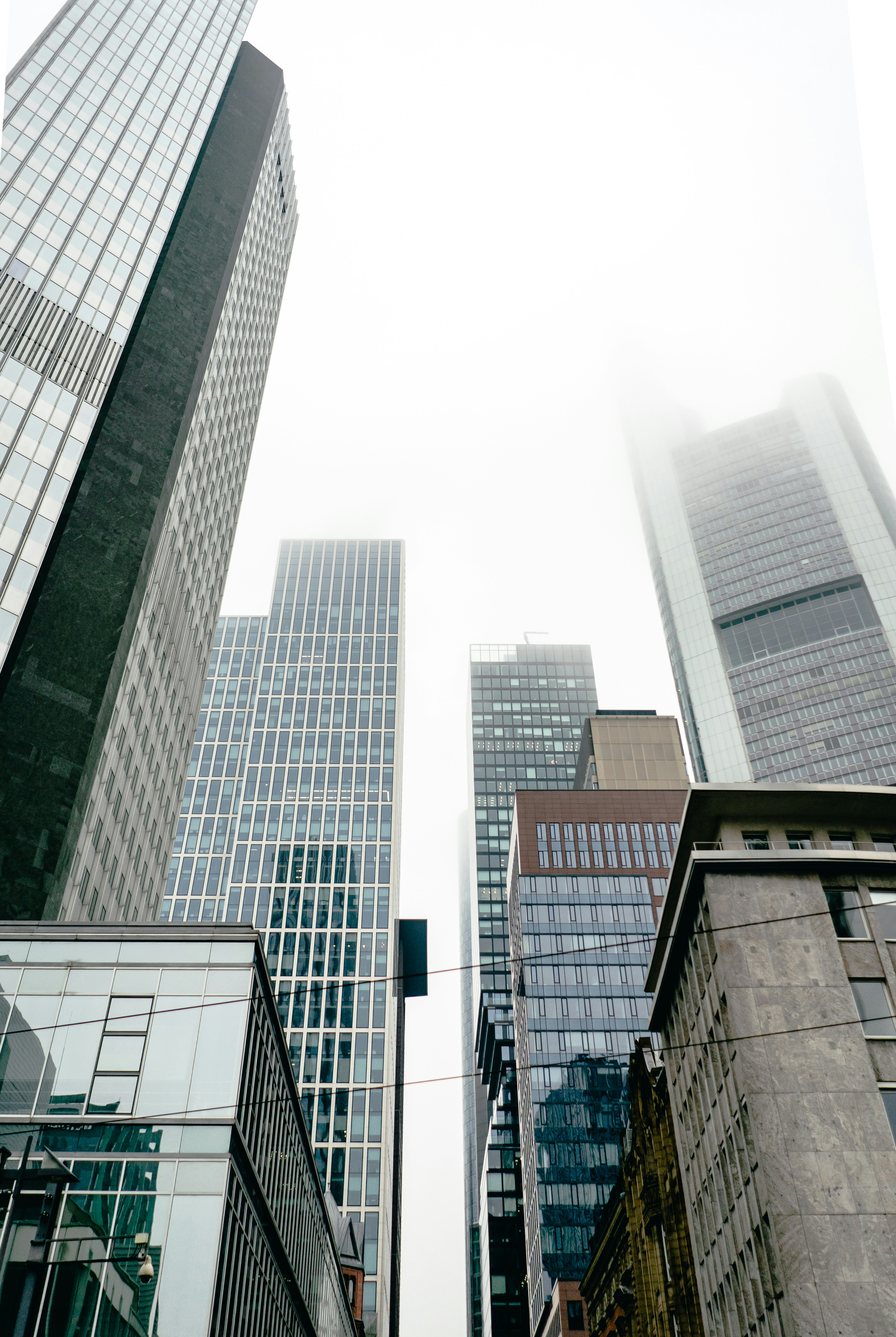 a couple of tall buildings sitting next to each other