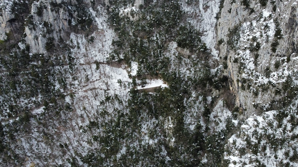 an aerial view of a snow covered mountain