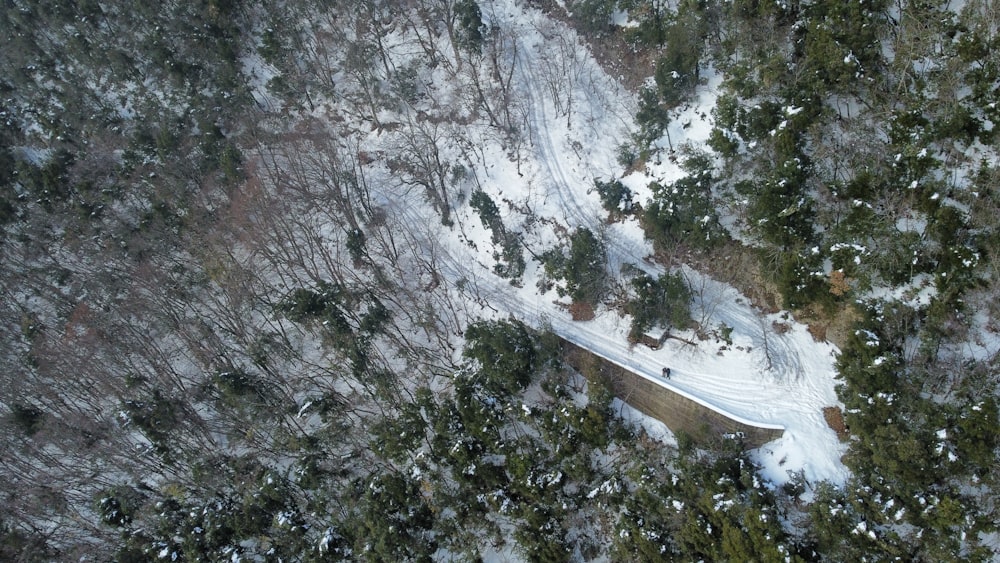 an aerial view of a snow covered road