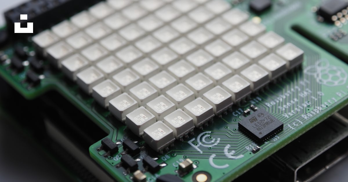 A close up of a computer chip on a table photo โ Free Electronics Image ...