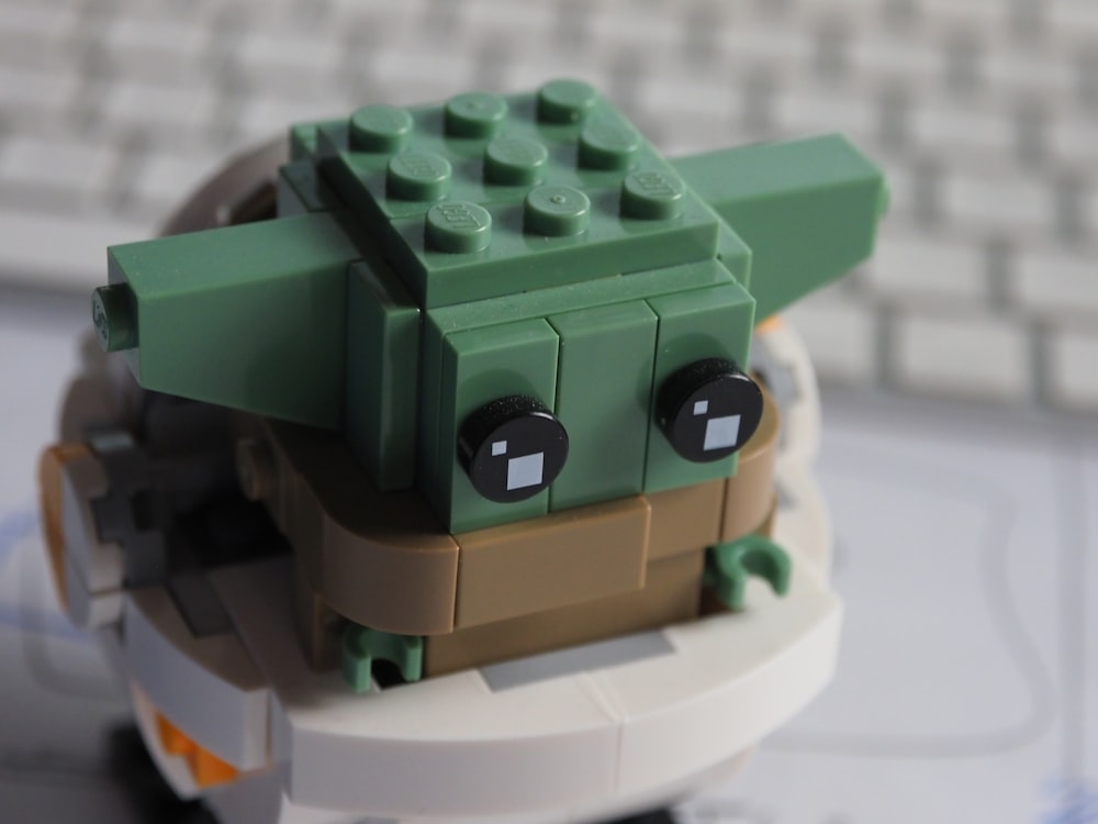 a close up of a lego toy with a baby yoda on it