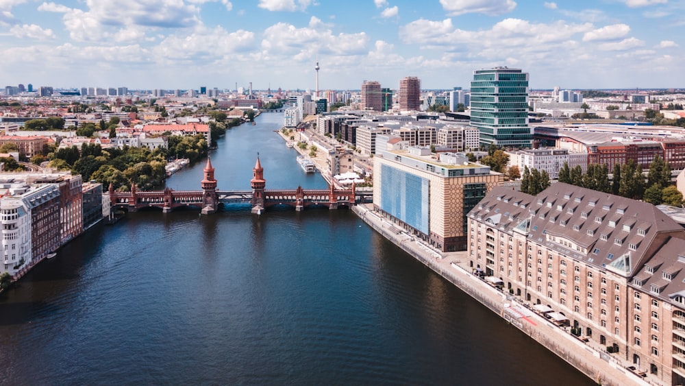 a river running through a city next to tall buildings