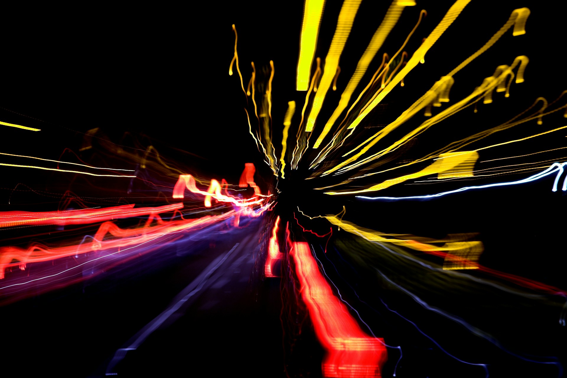 a blurry photo of a city street at night
